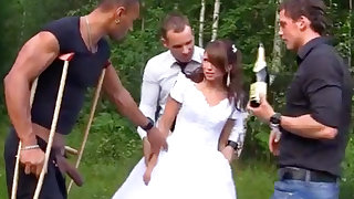 Russian bride enjoys an interracial gang-bang outdoors